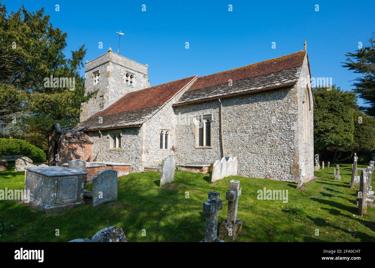 Grade 1 listed parish church of Saint Nicholas (St Nicholas Church), a historic chapel & cemetery in Poling, West Sussex, England, UK. Stock Photo