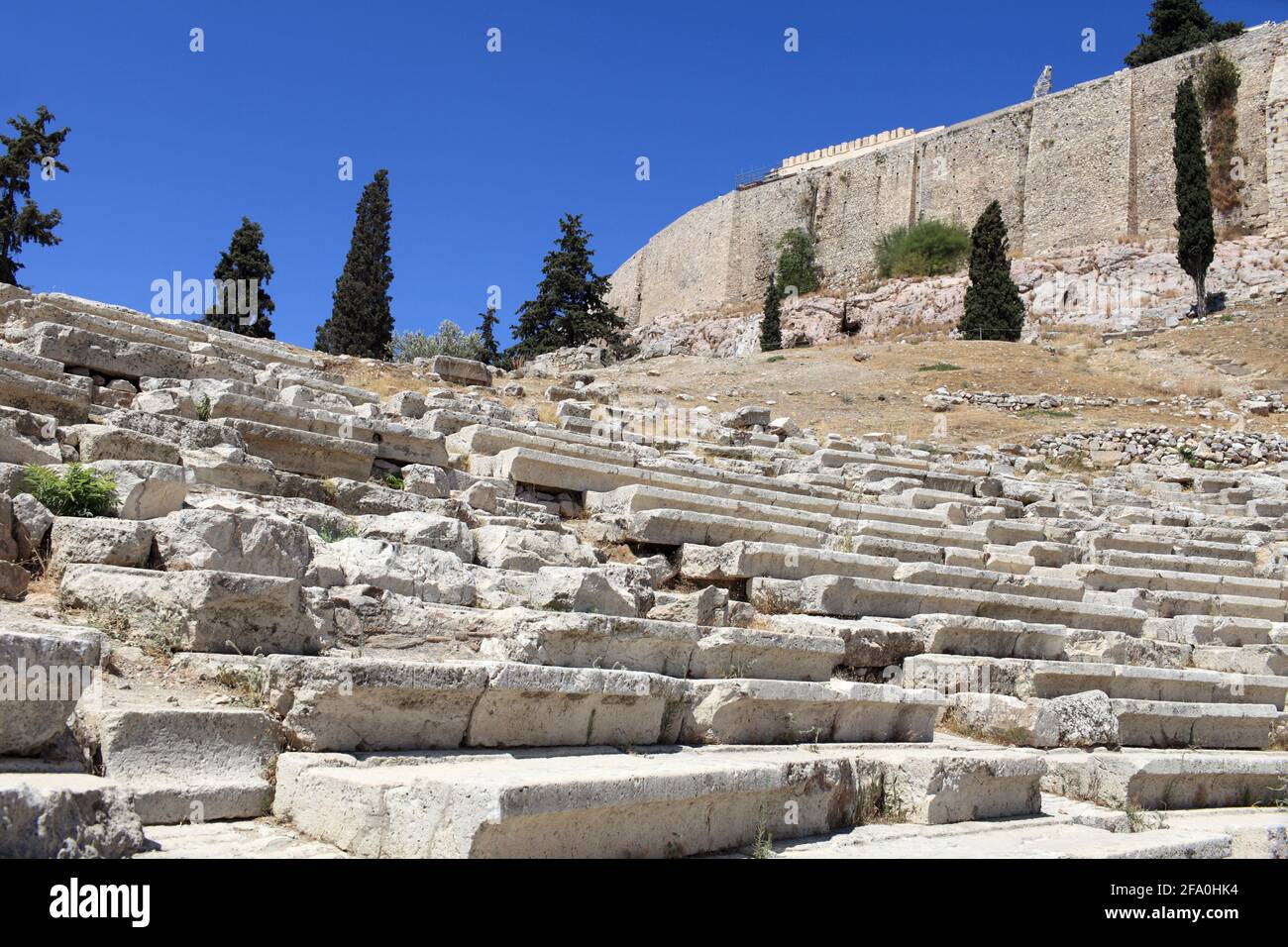 Theatre of Dionysus with Acropolis behind in summer, Athens, Greece Stock Photo