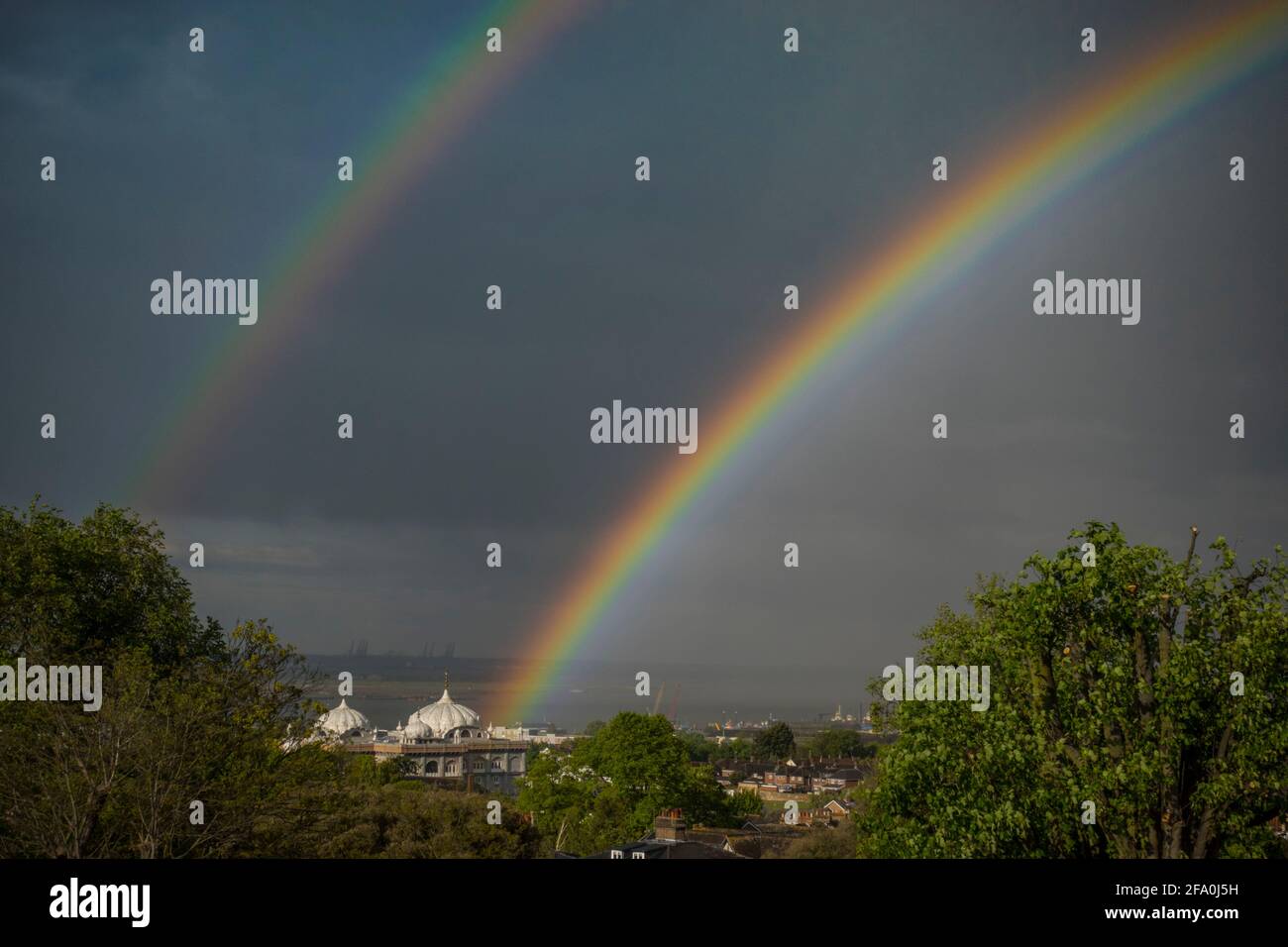 Rainbow over the Sikh Temple in Gravesend Kent, from Windmill hill Stock Photo