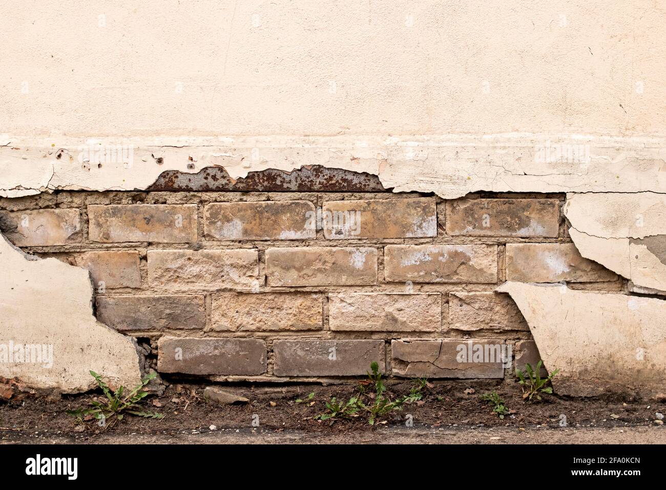 Peeling paint on an old brick wall close up Stock Photo