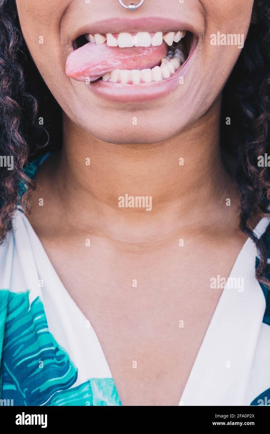 close-up African woman sticking out her tongue Stock Photo