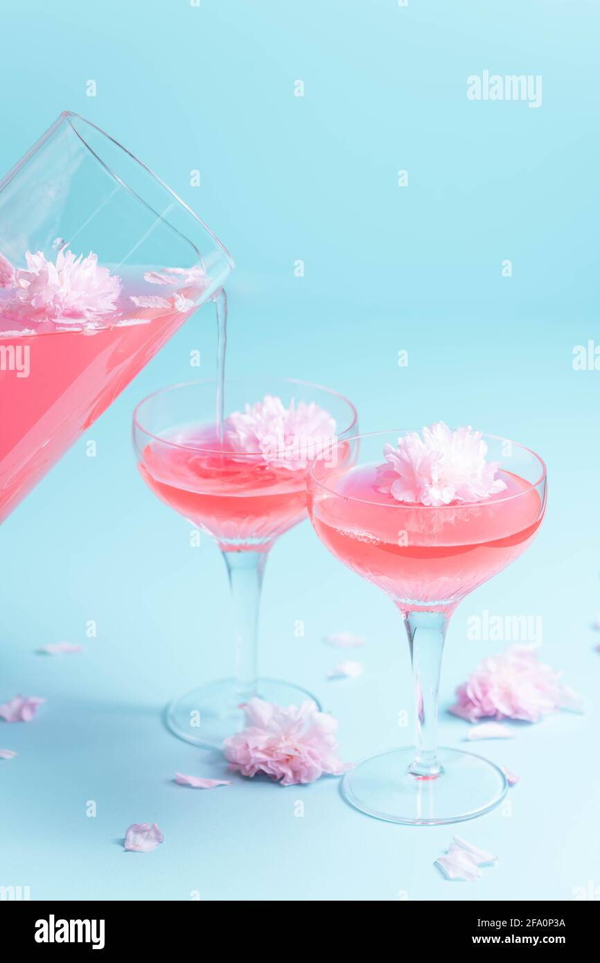 Rosé cocktails with a flower garnish Stock Photo Alamy