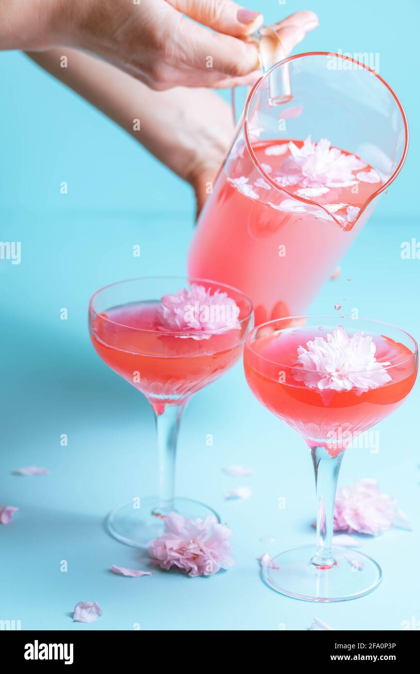 Rosé cocktails with a flower garnish Stock Photo Alamy