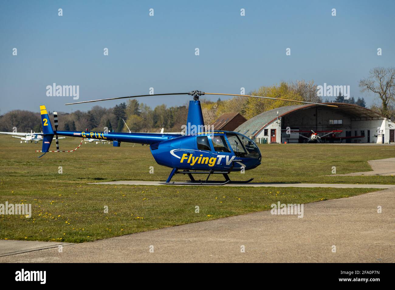 Aerial filming cinematography helicopter platform, Flying TV ,Robinson R44 Raven , Denham Aerodrome , England UK Stock Photo