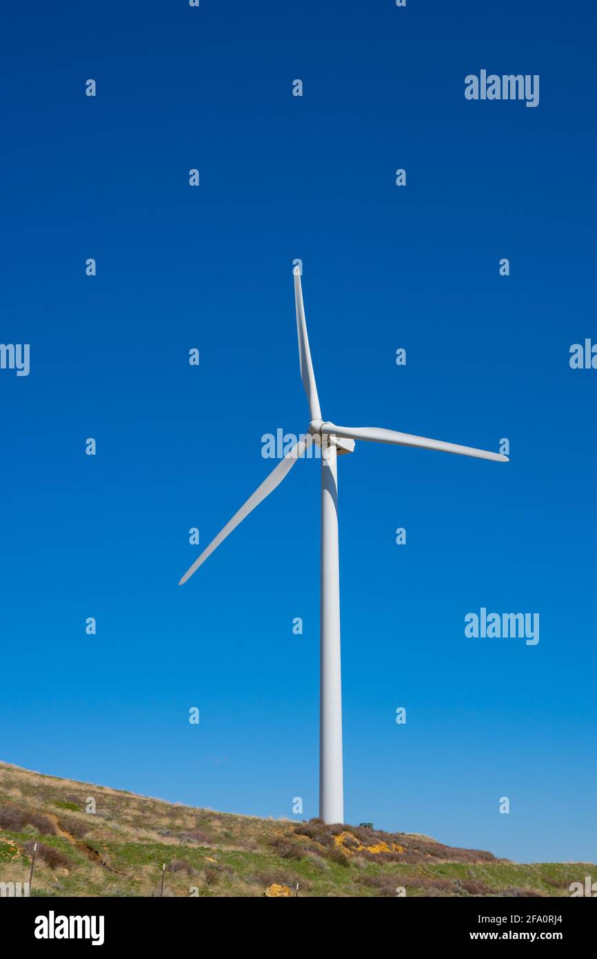 Wind turbines power nearby homes in the mountains above Los Angeles California Stock Photo