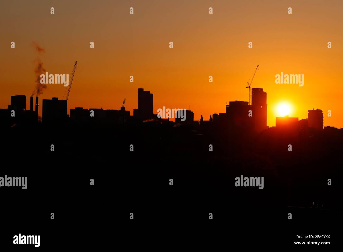 Sunrise behind Leeds City Centre skyline.Yorkshire's tallest building 'Altus House' is currently under construction Stock Photo