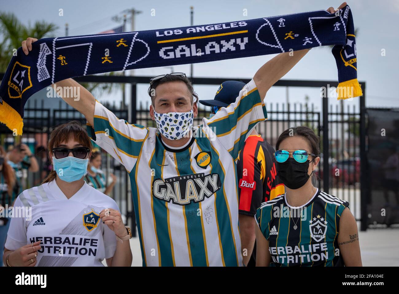 Fort Lauderdale, Florida, USA - April 18, 2021: LA Galaxy soccer fans cheering on their team during a soccer match at MLS 2021 in DRV Pink Stadium. Stock Photo
