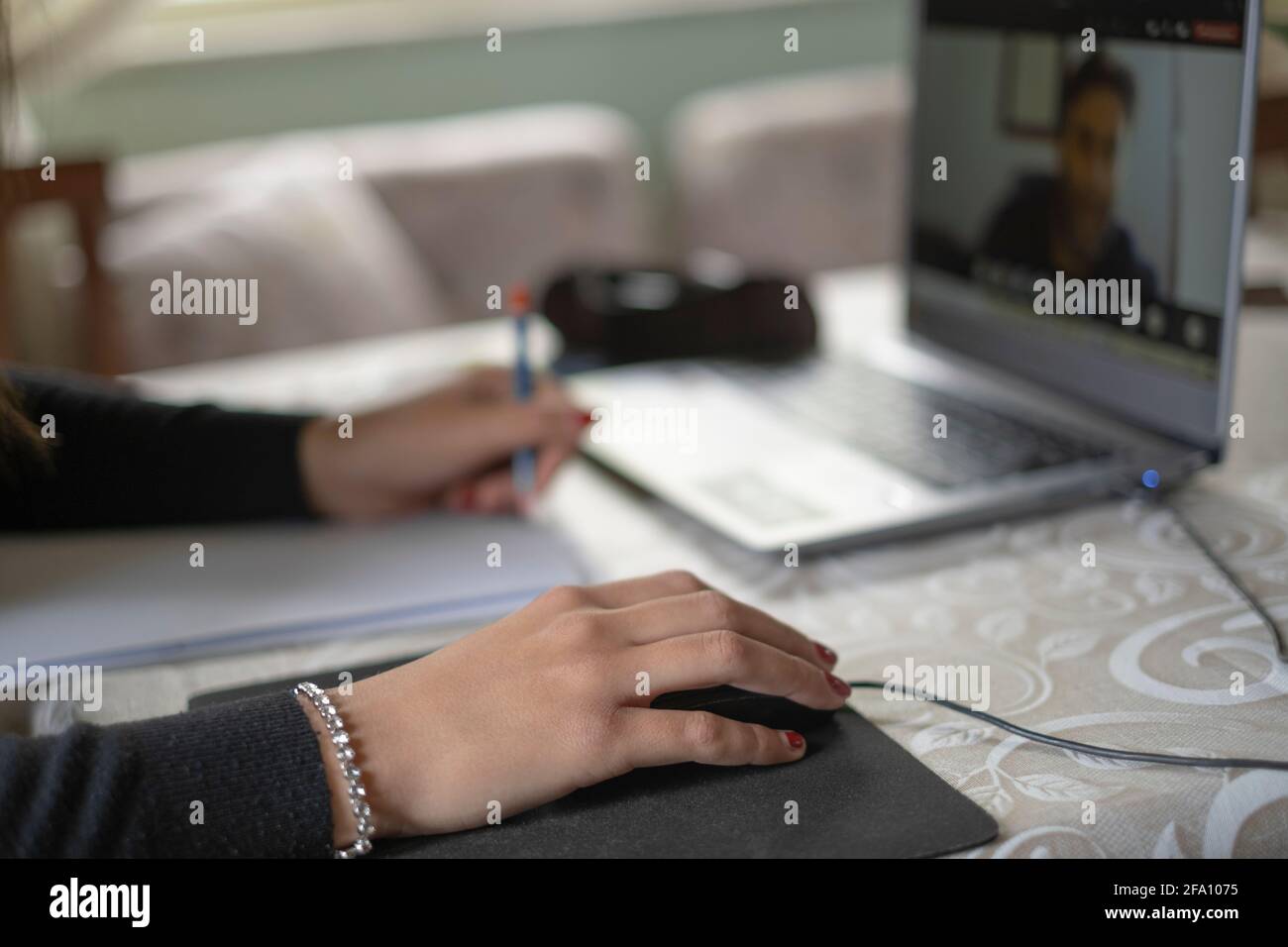 Young girl study at home while use notebook for remote schooling video call,covid-19 pandemic Stock Photo