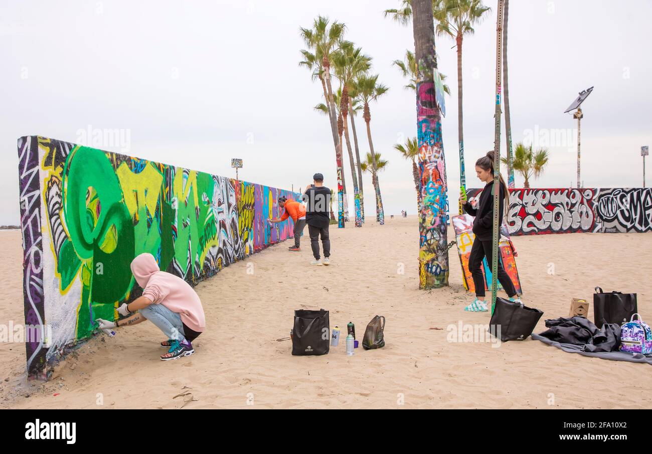 Graffiti artists paint walls on Venice Beach, Los Angeles, California, USA Stock Photo