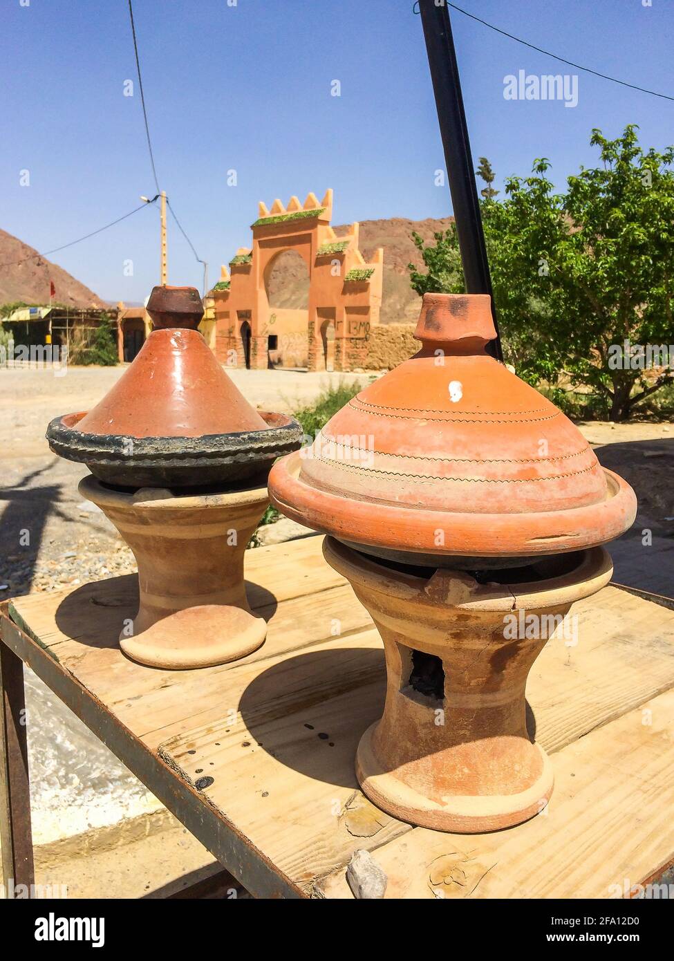 Basic tajine - shallow earthen pot named after the earthenware pot in which  it is cooked - prepared in restaurant by the road Stock Photo - Alamy