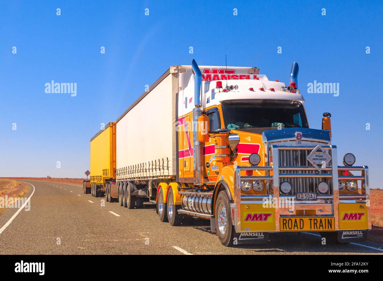 Northern Territory, Australia - August 27, 2019: Mansell group, road-train truck of Kenworth crossing the highways of the Northern Territory of Stock Photo