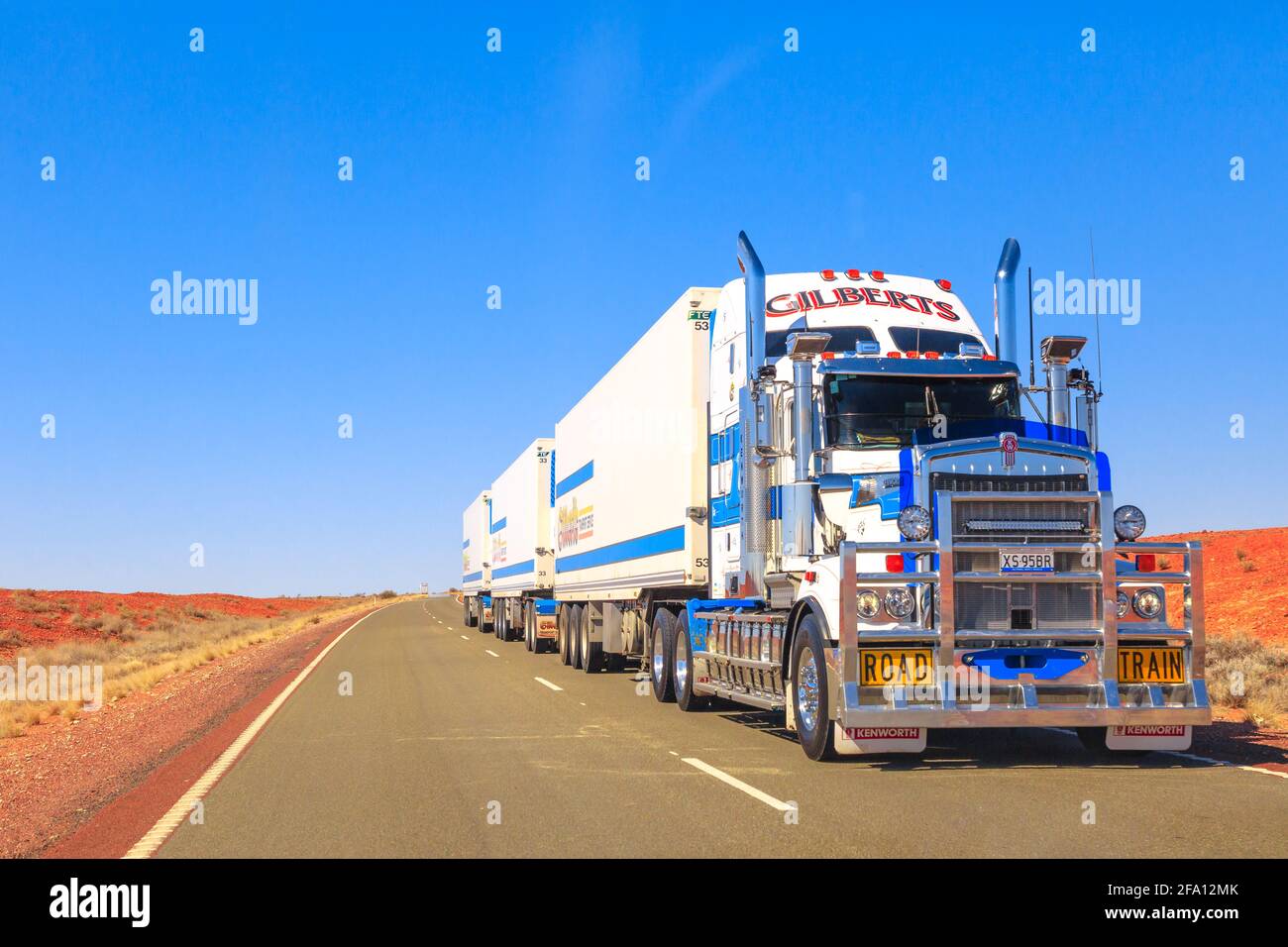 Northern Territory, Australia - August 27, 2019: Gilberts road-train truck of Kenworth crossing the highways of the Northern Territory of Australian Stock Photo