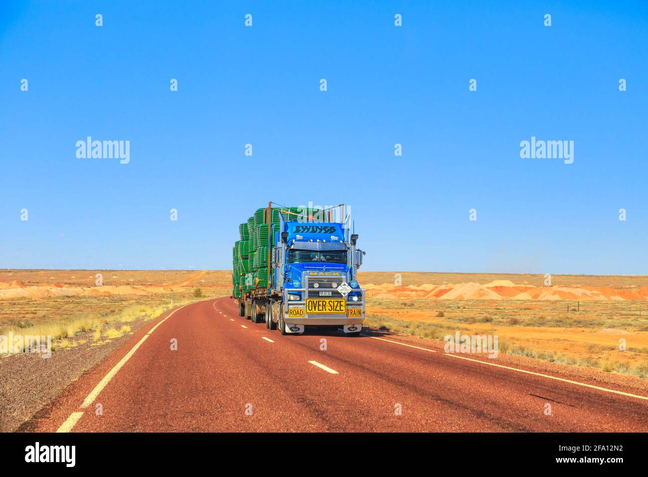 Northern Territory, Australia - August 27, 2019: Ewings Mack road-train truck crossing the highways of the Northern Territory of Australian Outback. Stock Photo