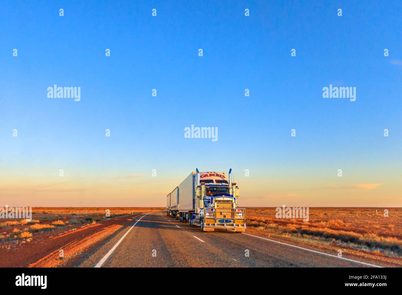 Northern Territory, Australia - August 29, 2019: Gilberts road-train truck of Kenworth crossing the highways of the Northern Territory of Australian Stock Photo