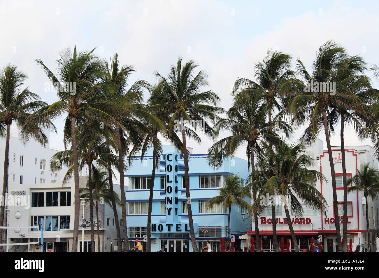 Ocean Drive Hotel buildings. Art deco area. Famous Colony Hotel and Boulevard Hotel. Also, a CVS on ocean drive is spotted. Stock Photo