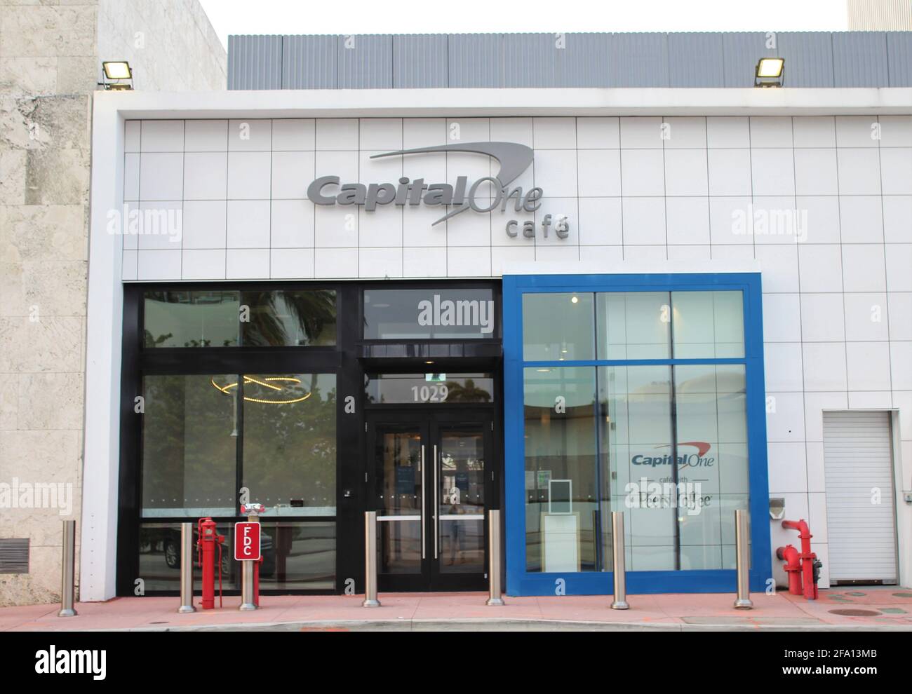 A store front sign for a Capital One Cafe on Lincoln Road in Miami Beach, Florida. Stock Photo
