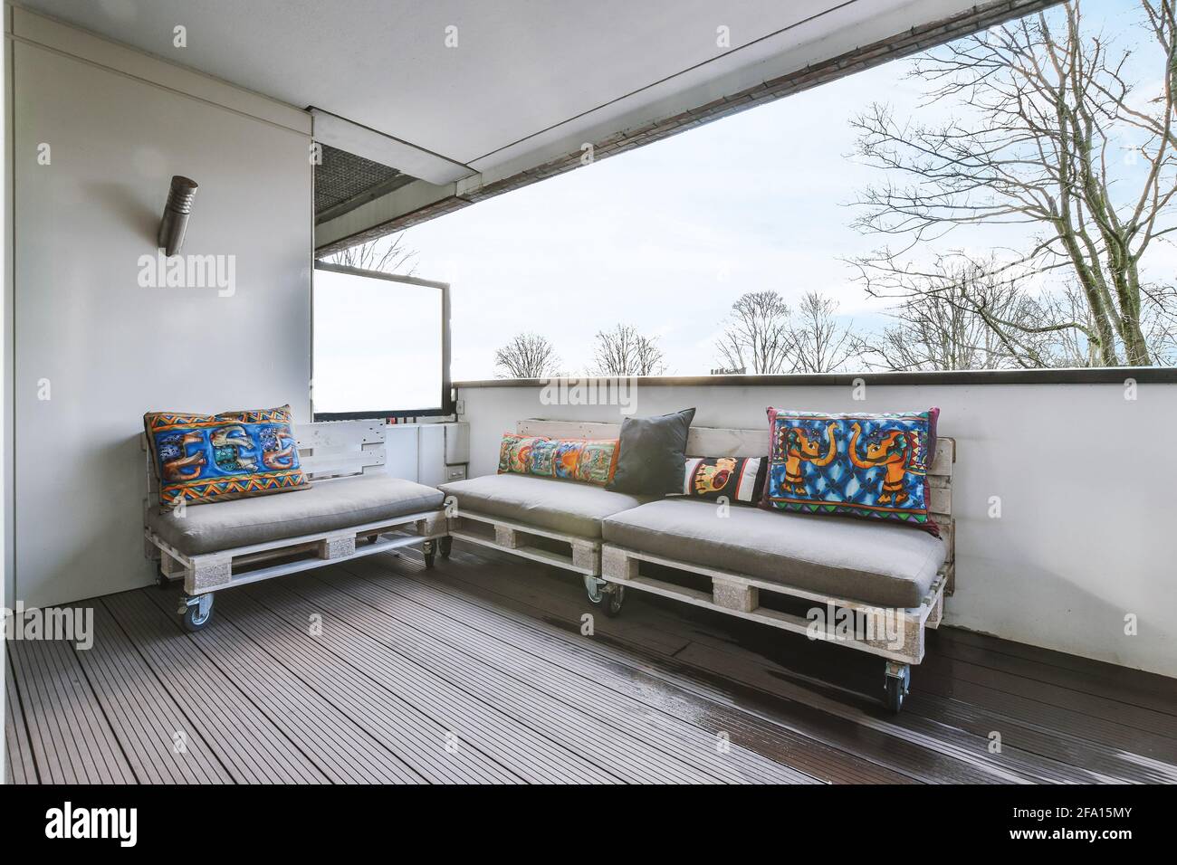 Modern couches on apartment balcony Stock Photo Alamy