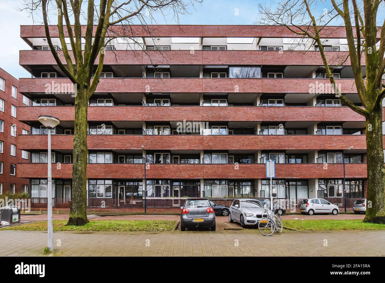 Parking lot near apartment building Stock Photo - Alamy