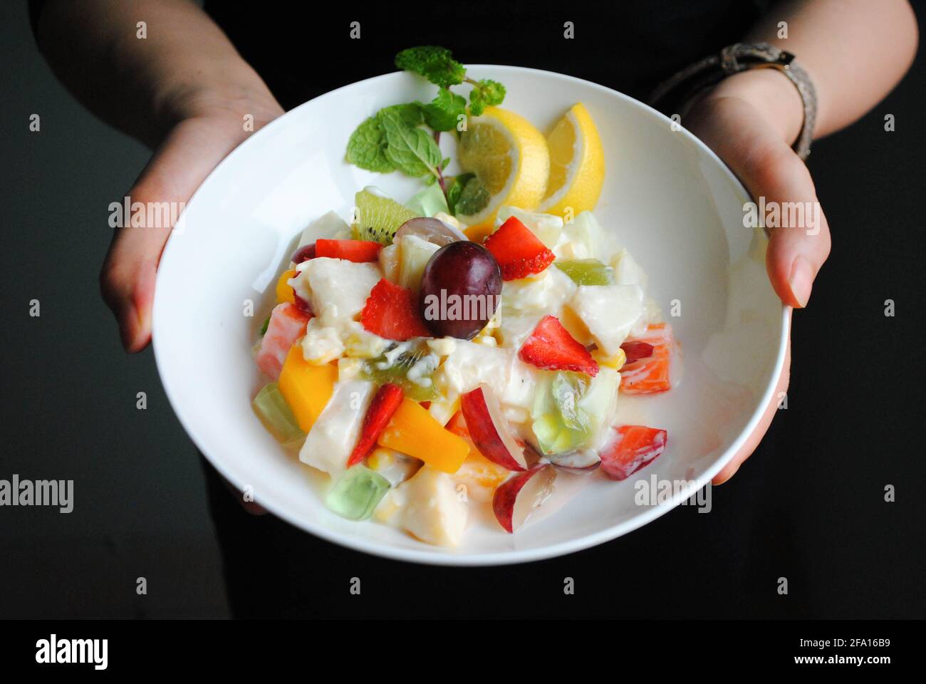 A plate of Fresh Fruit Salad for your soul. Fuit salad is always a good option for healthy food, because it has less calories, fat, and it taste great Stock Photo