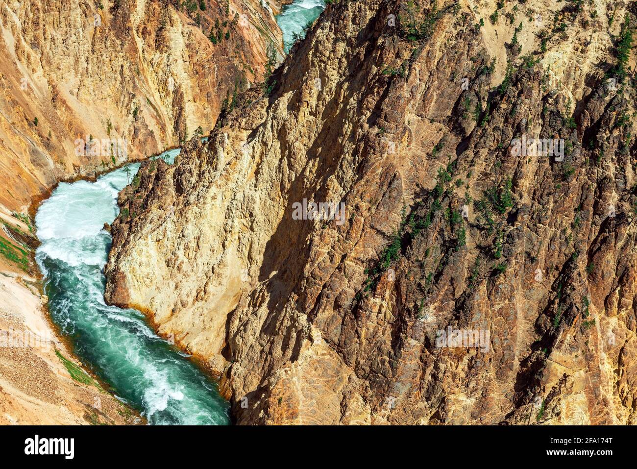 Turquoise Yellowstone River cutting through the Grand Canyon of Yellowstone with yellow and red colors, Yellowstone national park, Wyoming, United Sta Stock Photo