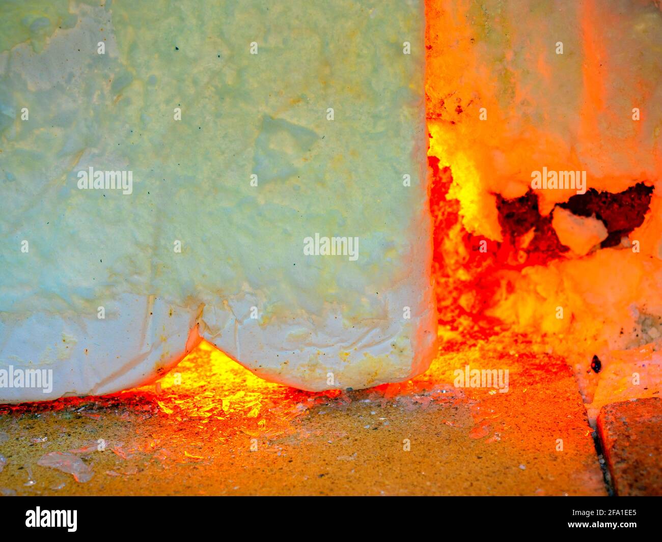 Shining glass blowing furnace behind cover. Gas kiln in glass design