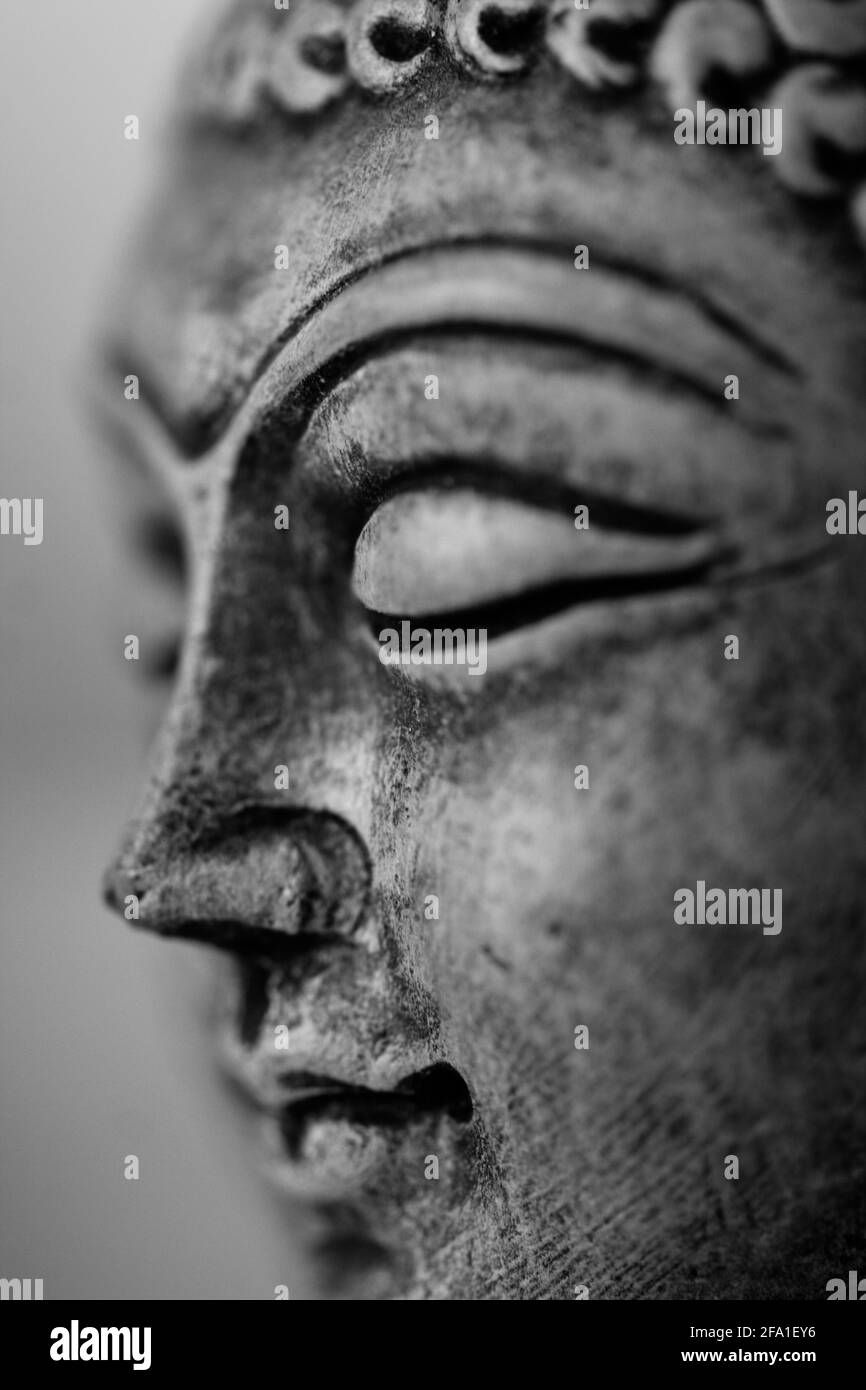 Buddha face sculpture closeup macro photo Stock Photo