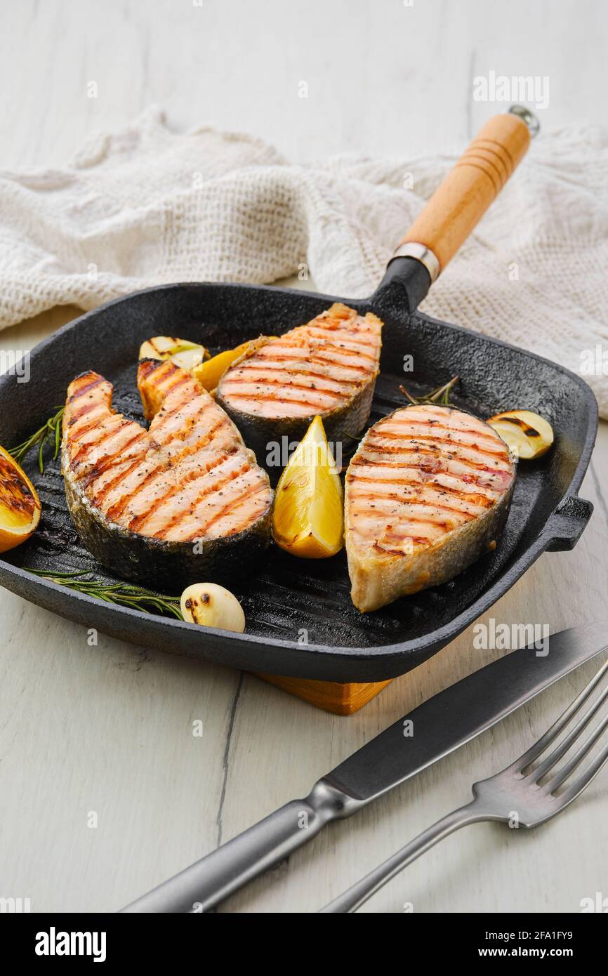 Grilled trout steaks on pan Stock Photo Alamy