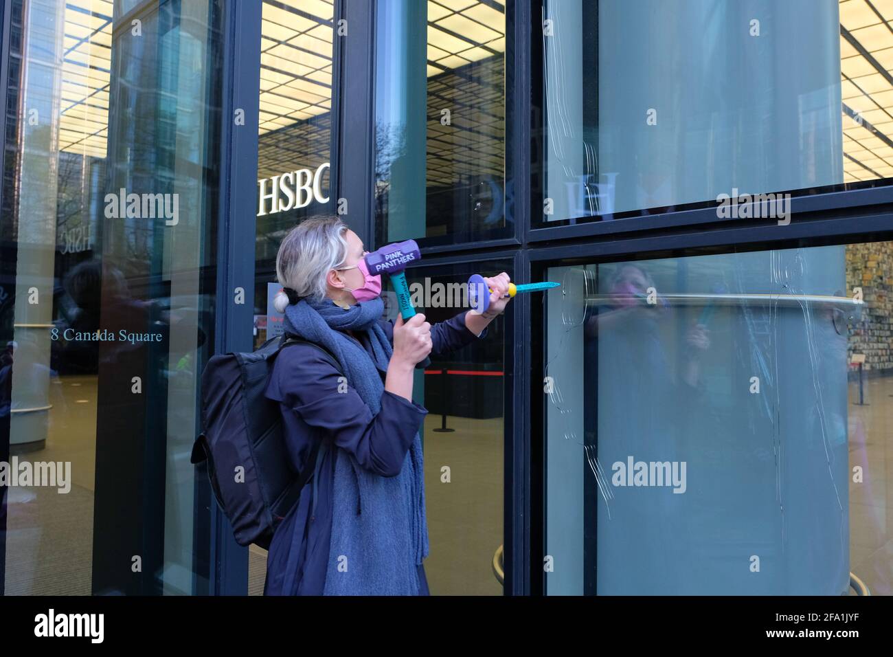 London, UK. April 22nd, 2021. Extinction Rebellion women break the windows of HSBC to condemn the bank’s 80 Billion pound investment in fossil fuels over the past 5 years. The group had signs that read “Better Broken Windows than Broken Promises”. Credit: Joao Daniel Pereira. Credit: João Daniel Pereira/Alamy Live News Stock Photo