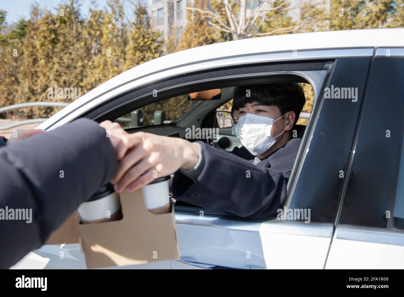 Asian couple spending time separately on bed Stock Photo Alamy