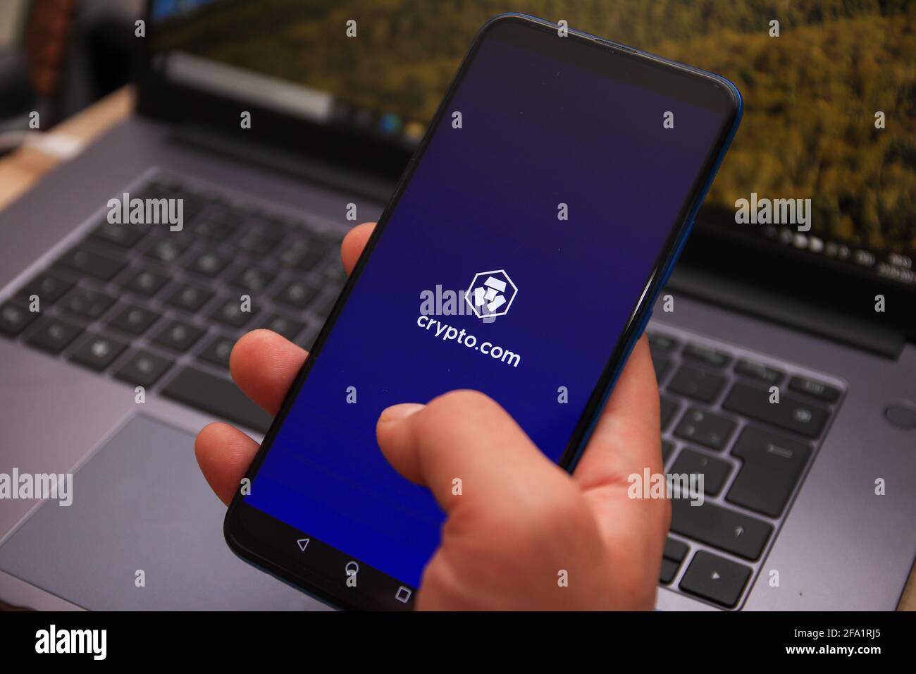 Berlin, Germany - April 22, 2021: Crypto.com (MCO) cryptocurrency logo displayed on smartphone. Crypto.com is a cryptocurrency and payment platform. Stock Photo