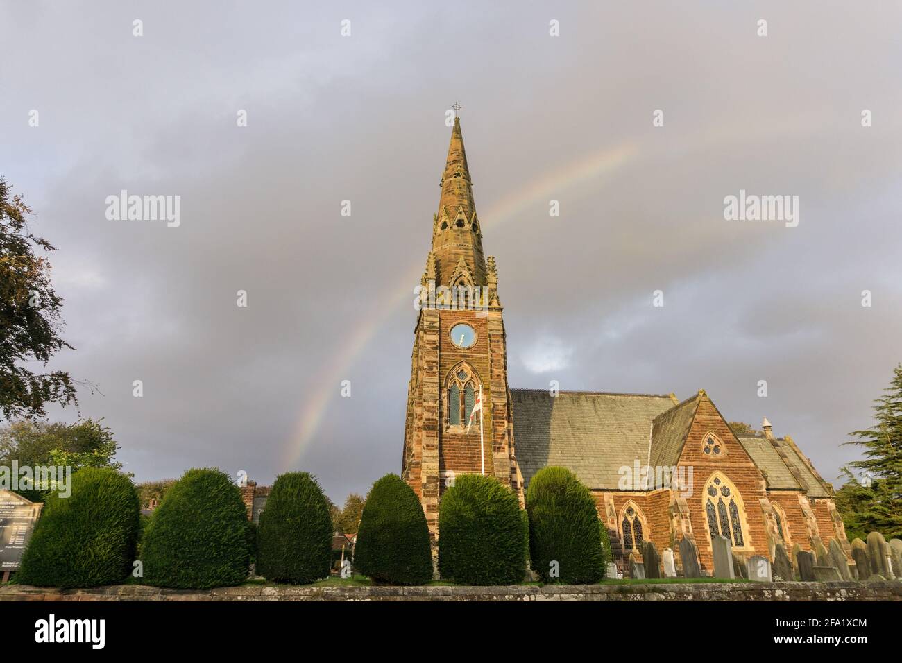 The parish church of All Saints in the village of Thornton Hough, Wirral, UK; dates from 1868 and paid for by Joseph Hirst a woollen mill owner. Stock Photo