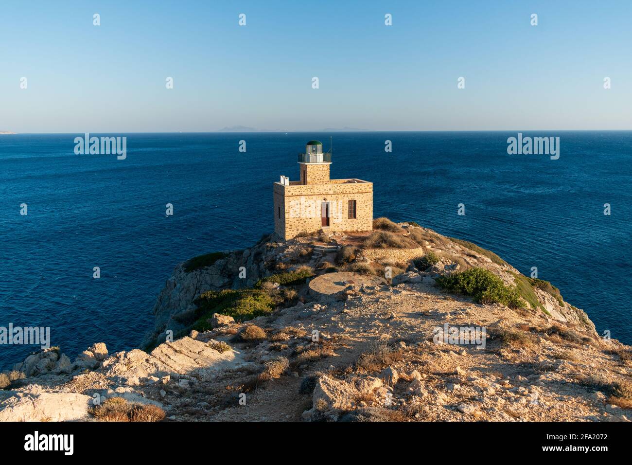 Lighthouse in the port in Ios , Greece Stock Photo