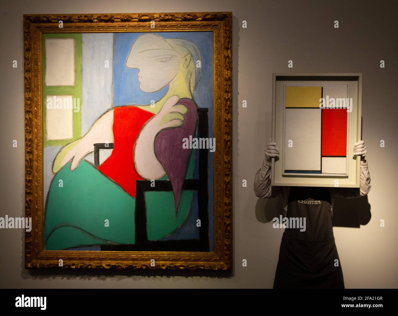London, UK. 22nd Apr, 2021. 'Femme assise prs d'une fentre (Marie-Thrse)' By Pablo Picasso, estimated $55 Million with 'Composition Number II with yellow, Red and Blue' by Piet Mondrian, estimated $25 Million. Highlights from the New York Spring season of Evening sales. Credit: Mark Thomas/Alamy Live News Stock Photo