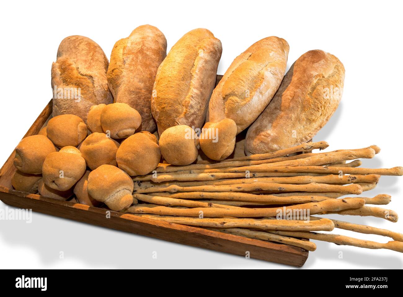 Italian bread, large rustic loaves and fresh baked buns with olive breadsticks in wooden tray, isolated on white Stock Photo
