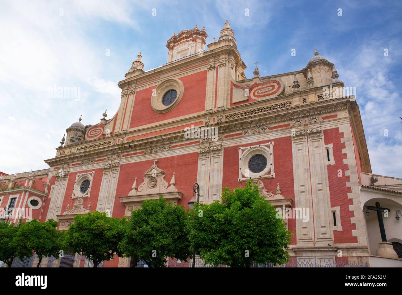 Historic buildings and monuments of Seville, Spain. Architectural details, stone facade and museums Europe. Spanish architectural. Iglesia Colegial Sa Stock Photo