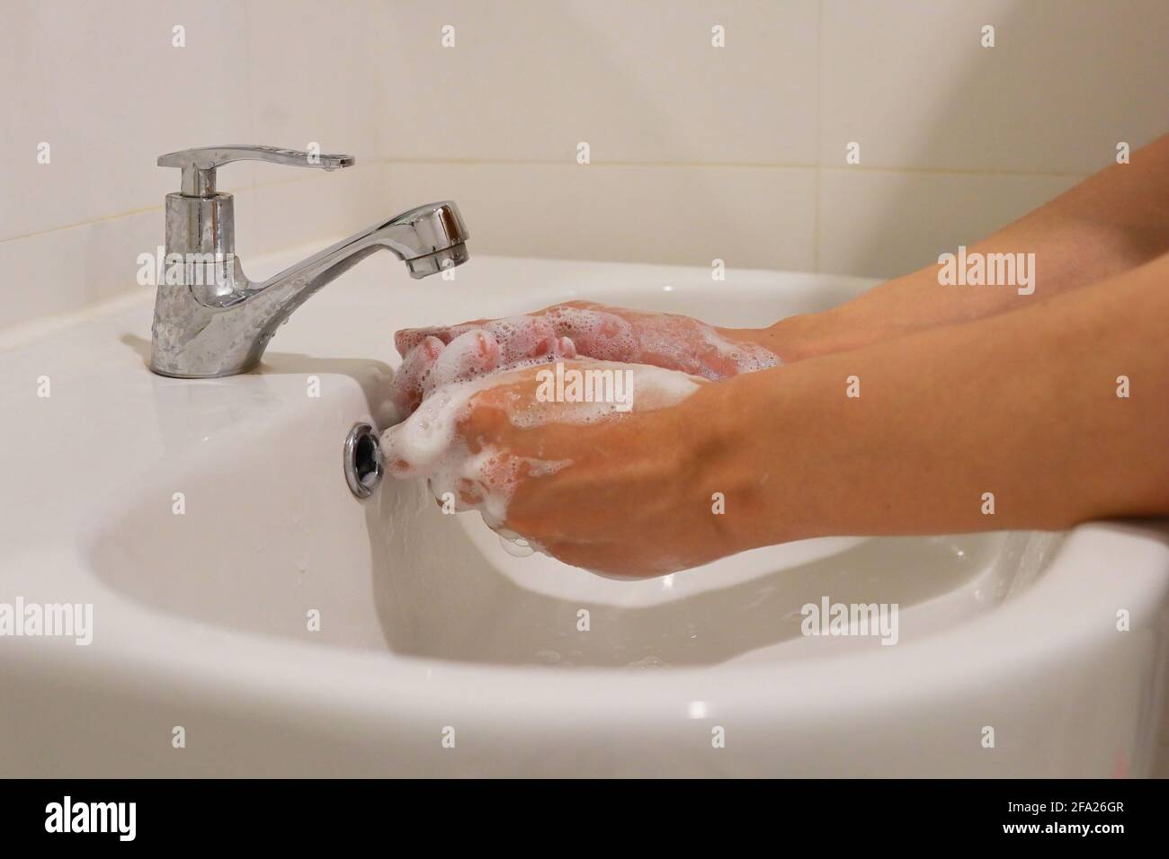 close up of washing hand in bathroom Stock Photo