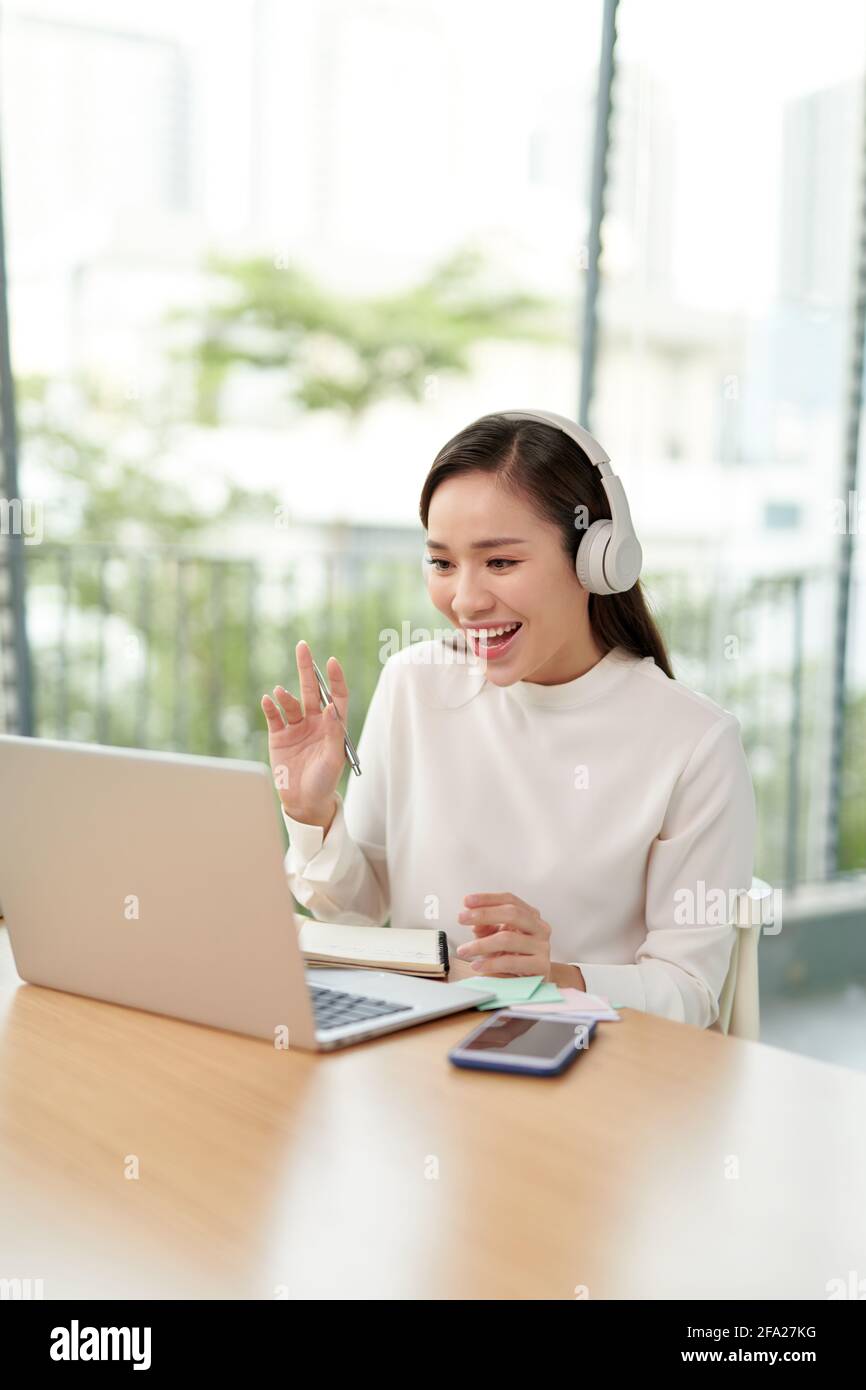 Freelance business women casual wear using laptop working call video conference with customer in workplace in living room at home. Stock Photo