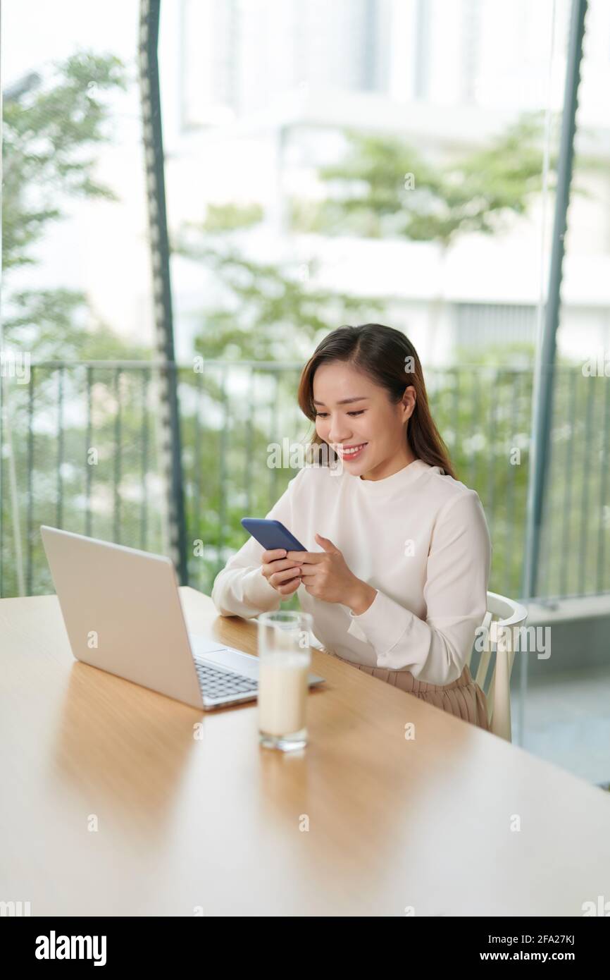 asian woman using computer in room Stock Photo - Alamy
