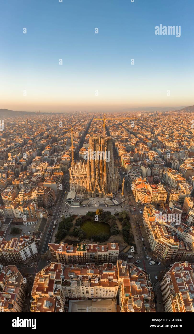 Aerial drone shot of Barcelona city center in Sunrise golden hour during Spain winter Stock Photo