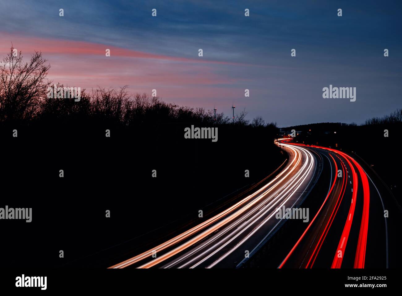 Car light trails at sunset Stock Photo