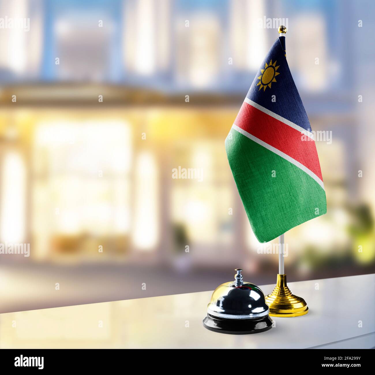 Namibia flag on the reception desk in the lobby of the hotel Stock ...