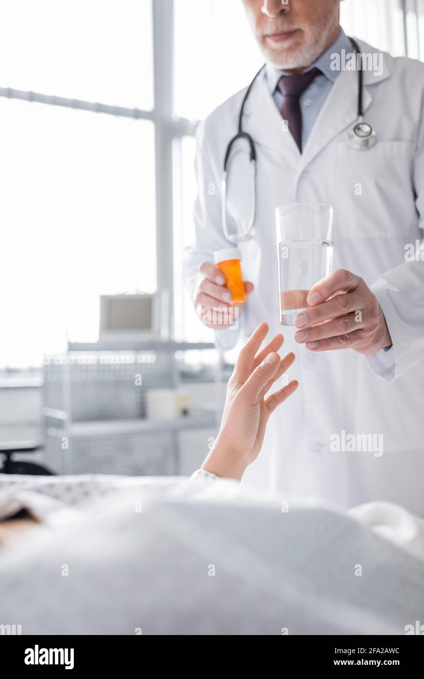 Beautiful mature doctor giving hi-res stock photography and images - Alamy