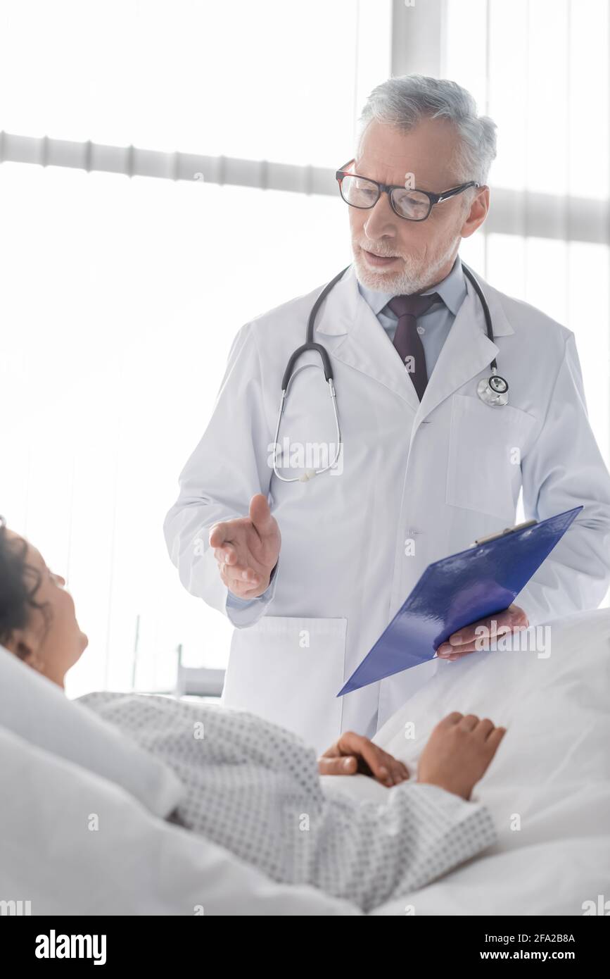 Doctor pointing hand talking woman hi-res stock photography and images ...