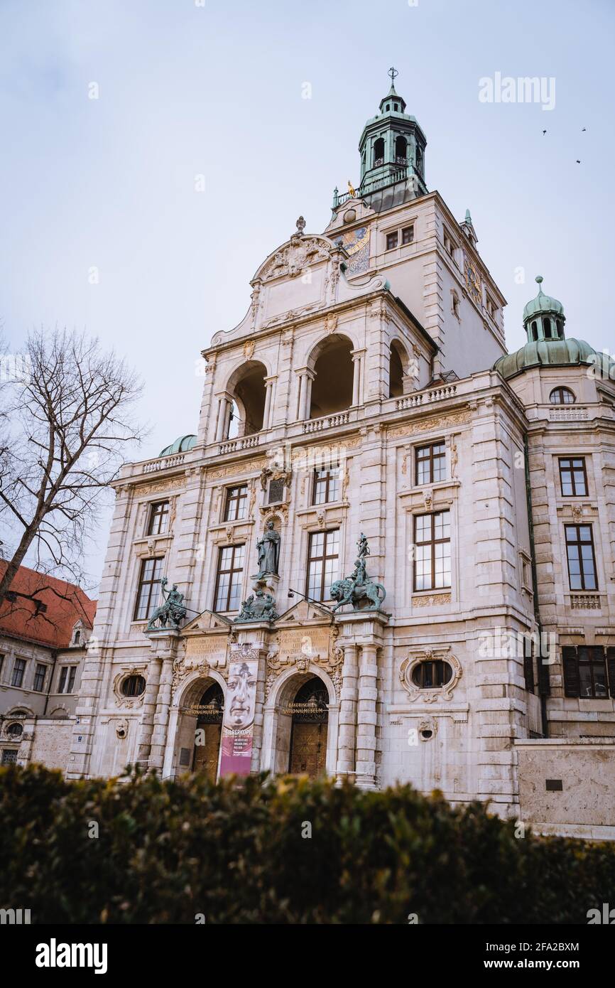 The bavarian national museum (art and culture gallery) in the city Munich. Constructed in 1900. A bronze rider statue stands in front of the building. Stock Photo