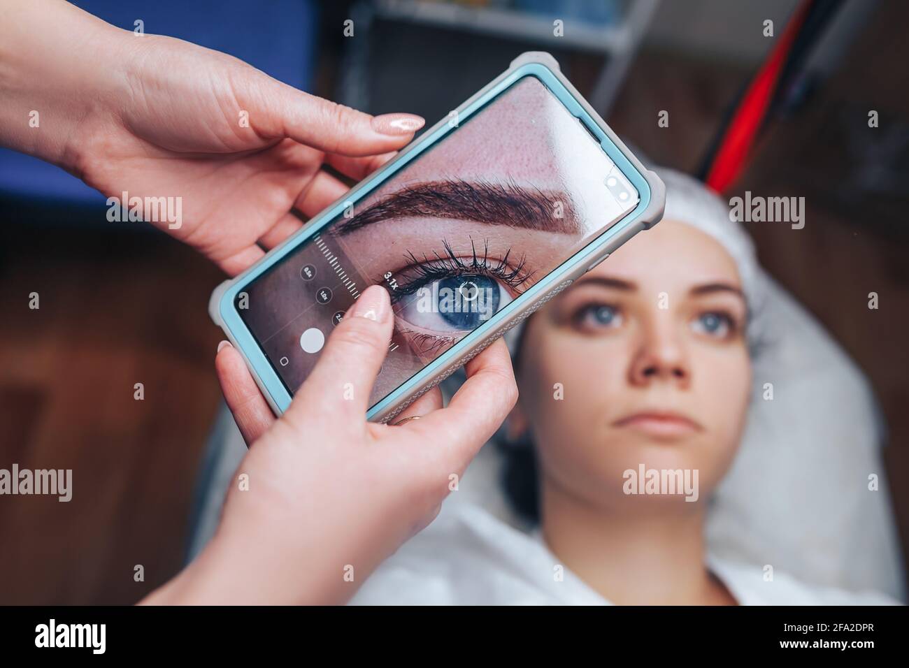 The Beautician Takes A Photo Of His Work After The Permanent Makeup 