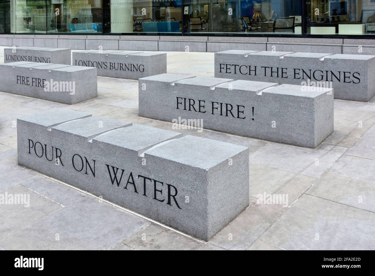 Large granite stone bench seat & engraved written words from Childs poem of historical Great Fire in City of London located beside Monument column UK Stock Photo