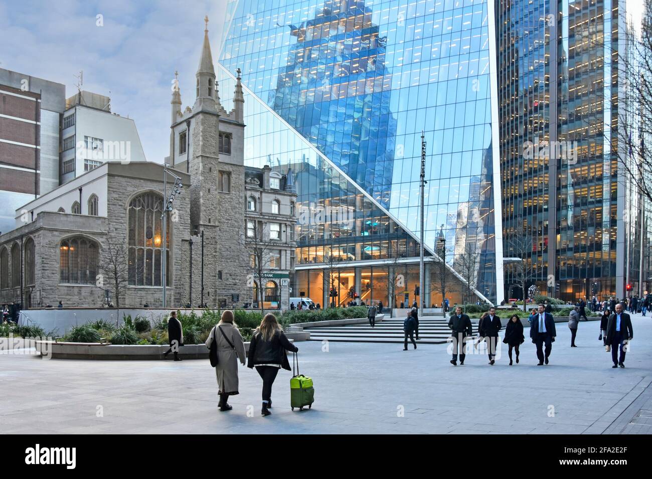 Historical St Andrew Undershaft church & modern Scalpel office skyscraper building people in street level scene Gherkin reflection City of London UK Stock Photo