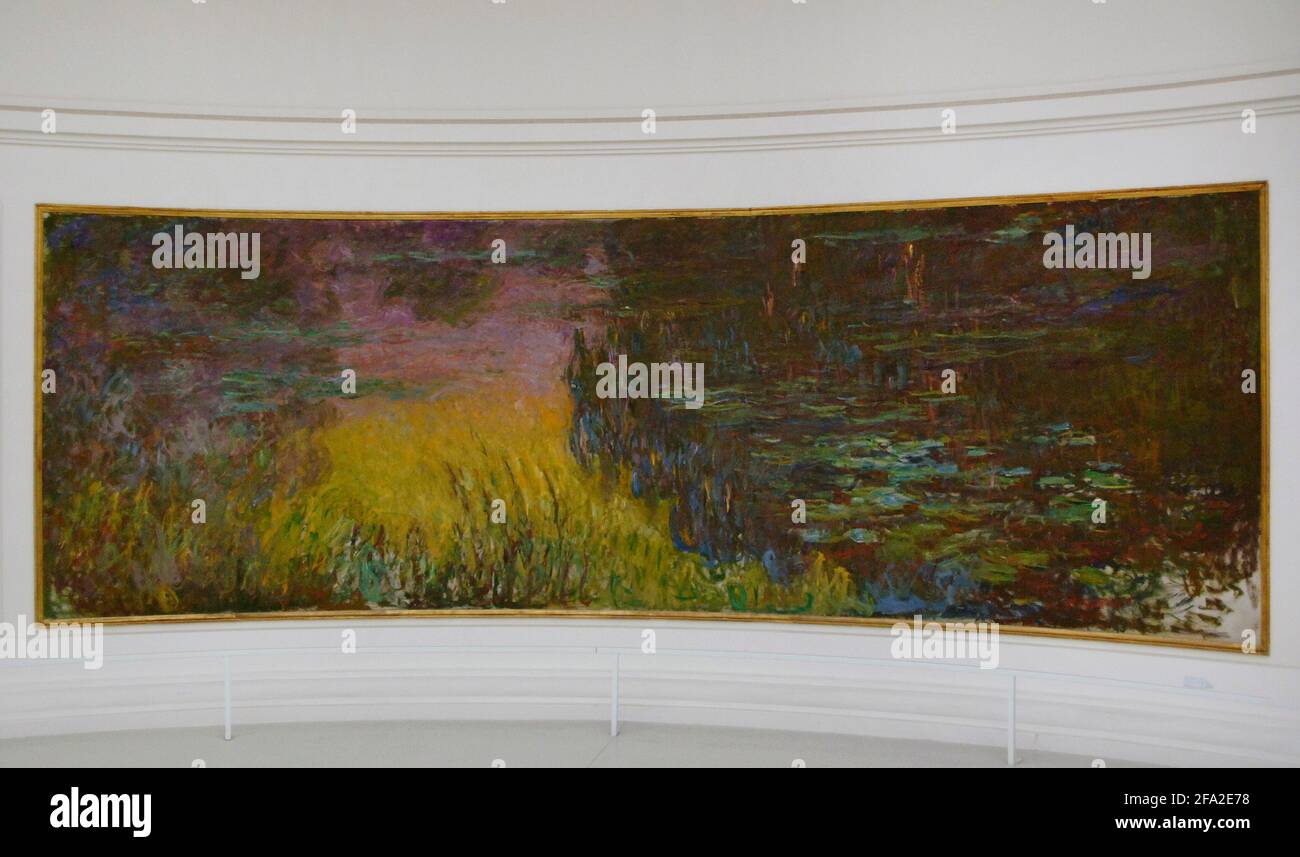 Claude Monet (1840-1926). French impressionist painter. The Water Lilies: Setting Sun, ca. 1915-1926. Oil on canvas (200 x 600 cm). Orangerie Museum. Paris. France. Stock Photo