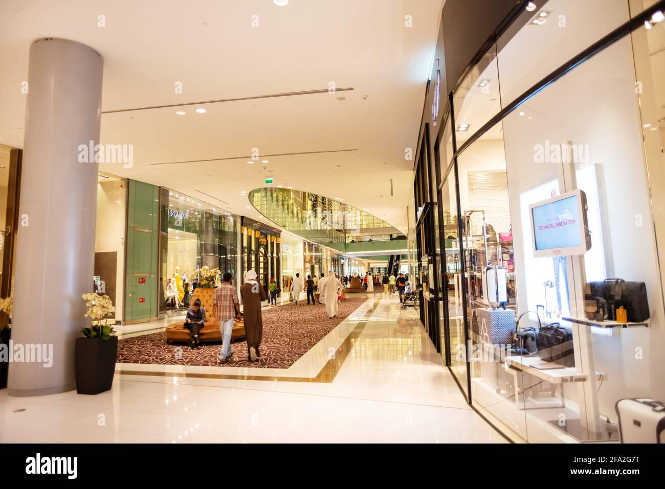 Exterior of Dubai Mall Fashion Avenue with valet parked expensive cars  outside , Downtown Dubai, United Arab Emirates