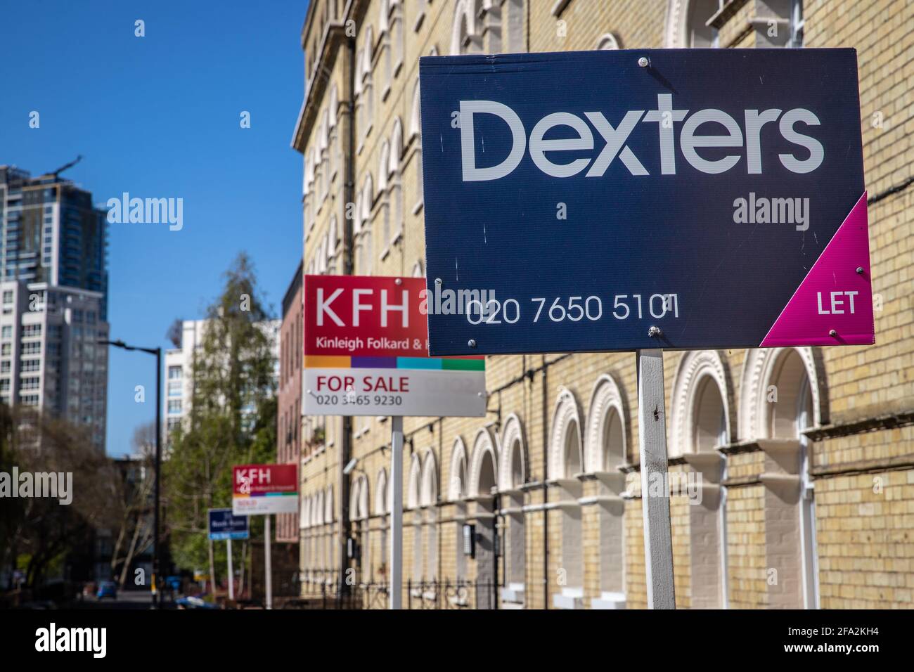 Estate agent signs outside a property Stock Photo